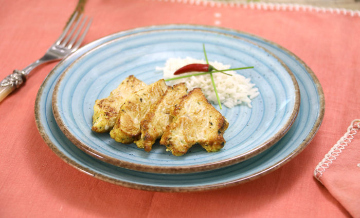 Pechugas de pavo cortadas en medallones a al curry cocinadas